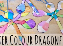 Water colour dragonfly painting with curled paper antennae and brad fasteners