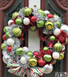 DIY Christmas Ball Wreath. Create your own fabulour Holiday Decor for Christmas with your stockpiles of christams bauble deocrations, and hot glue. And don't forget your friends