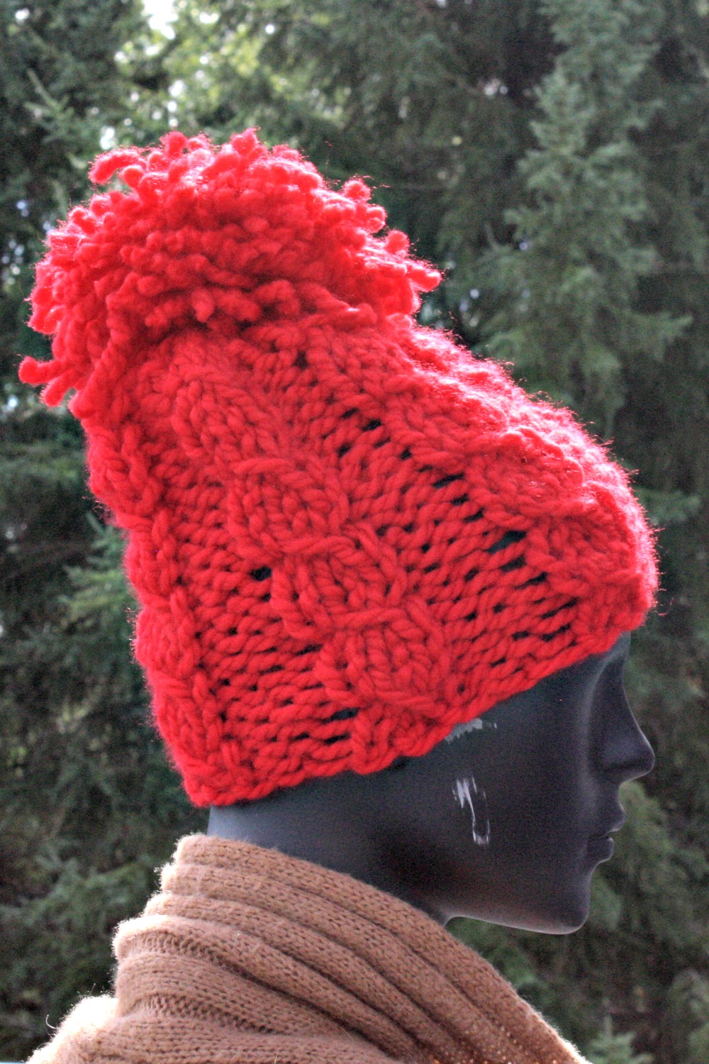 The Twisted Stitch Pom Pom Hat - Super Duper Knit Hats for Beginners - book of fabulous knitting patterns for hat suited for beginners and professionals